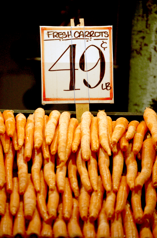 Carrots for sale at Pike's Market in Seattle, Washington photographed by Justin Winget