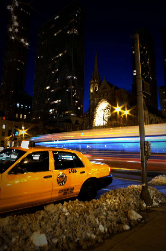 Bus and taxi on Michigan Avenue in Chicago, Illinois photographed by Justin Winget