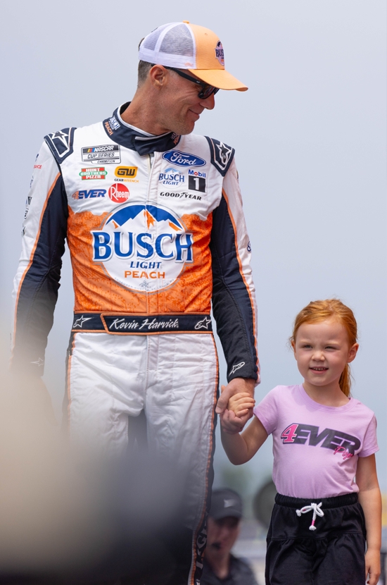 NASCAR driver Kevin Harvick and his daughter Piper Harvick at Michigan International Speedway in the Detroit Pistons x Ally livery by Justin Winget